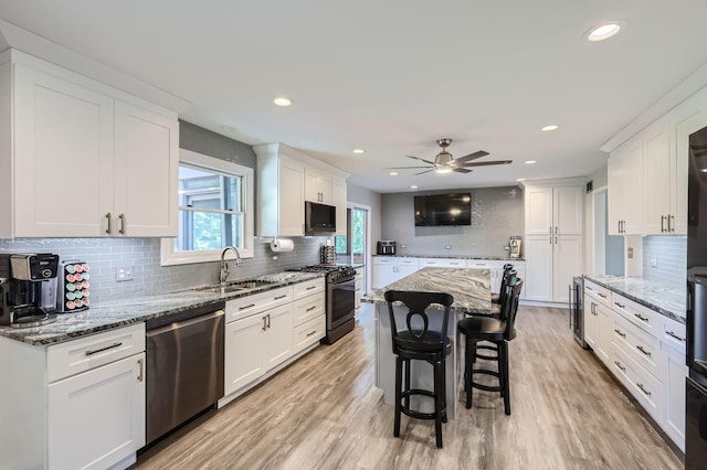 1718 Rosewood Ln, Johnsburg, IL 60051 - kitchen featuring stainless steel appliances, tasteful backsplash, white cabinetry, a ceiling fan, and recessed lighting