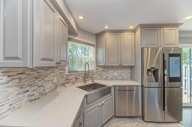 2716 Burton Dr, Westchester, IL 60154 - kitchen featuring appliances with stainless steel finishes, plenty of natural light, light countertops, gray cabinets, and recessed lighting