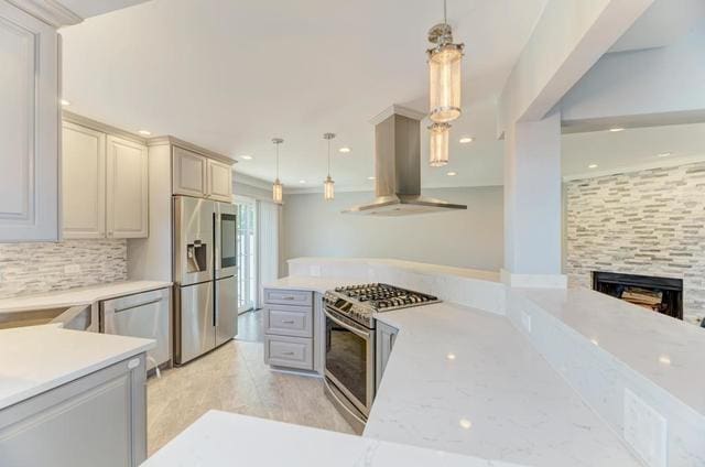 2716 Burton Dr, Westchester, IL 60154 - kitchen featuring appliances with stainless steel finishes, island exhaust hood, backsplash, decorative light fixtures, and a fireplace