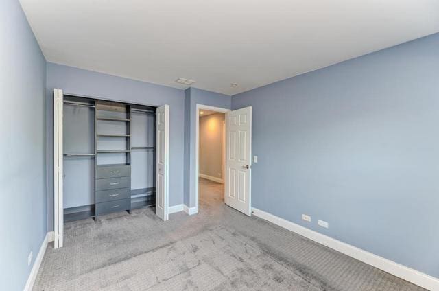 2716 Burton Dr, Westchester, IL 60154 - unfurnished bedroom with a closet and light colored carpet