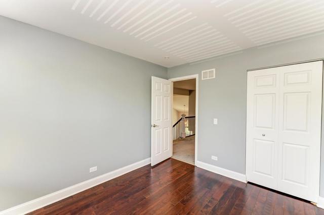 2716 Burton Dr, Westchester, IL 60154 - unfurnished bedroom featuring hardwood / wood-style flooring and a closet