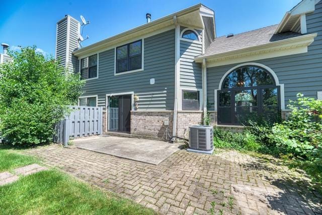 2716 Burton Dr, Westchester, IL 60154 - back of property featuring a patio area, a chimney, and brick siding
