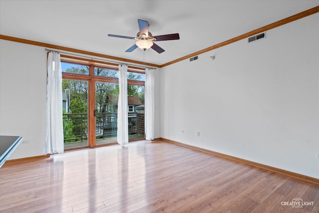 515 Main St Unit 402, West Chicago, IL 60185 - spare room with ornamental molding, ceiling fan, and light wood-style floors