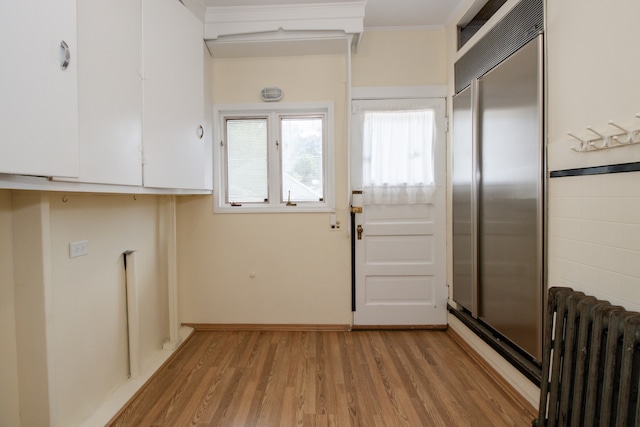 312 Home Ave, Oak Park, IL 60302 - washroom featuring radiator and light wood-style floors
