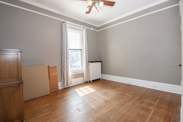 312 Home Ave, Oak Park, IL 60302 - unfurnished room with ceiling fan, wood finished floors, radiator heating unit, and crown molding