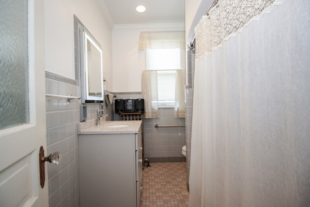 312 Home Ave, Oak Park, IL 60302 - full bath featuring tile walls, vanity, ornamental molding, wainscoting, and tile patterned flooring