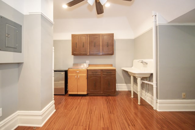 312 Home Ave, Oak Park, IL 60302 - kitchen with electric panel, a ceiling fan, light wood-type flooring, freestanding refrigerator, and light countertops