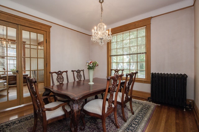 312 Home Ave, Oak Park, IL 60302 - dining area with radiator, a chandelier, and wood finished floors