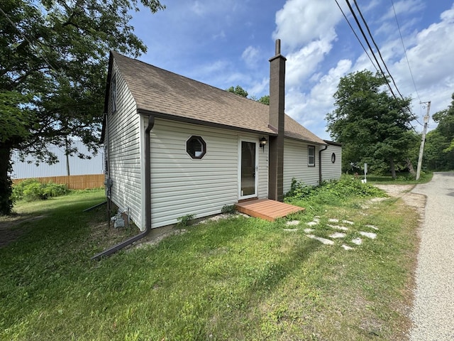 42309 N Woodbine Ave, Antioch, IL 60002 - view of front of property with a chimney, a front lawn, and roof with shingles
