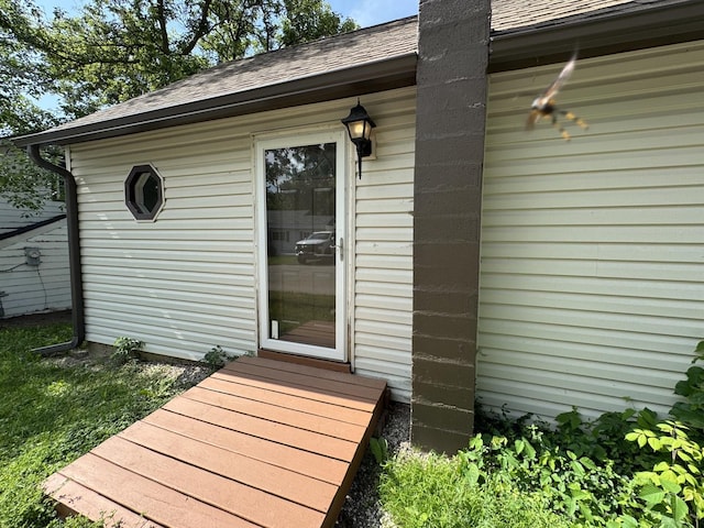 42309 N Woodbine Ave, Antioch, IL 60002 - doorway to property featuring roof with shingles and a chimney