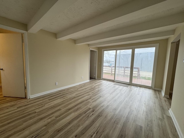 42309 N Woodbine Ave, Antioch, IL 60002 - unfurnished room featuring wood finished floors and beamed ceiling