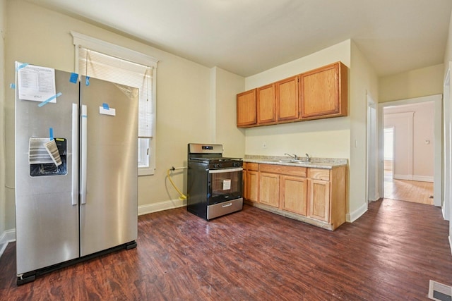 6225 S Wood St, Chicago, IL 60636 - kitchen with stainless steel appliances, light countertops, and dark wood-style floors
