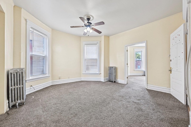 6225 S Wood St, Chicago, IL 60636 - unfurnished living room featuring radiator, carpet floors, and a ceiling fan