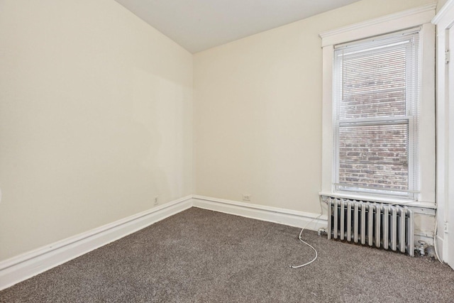 6225 S Wood St, Chicago, IL 60636 - carpeted empty room featuring radiator and baseboards