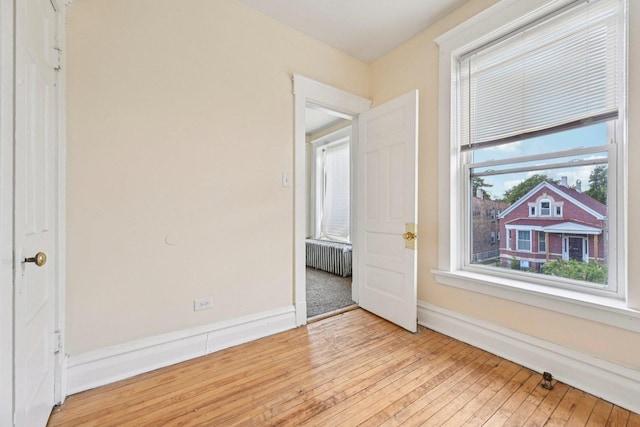 6225 S Wood St, Chicago, IL 60636 - empty room featuring radiator and light wood finished floors