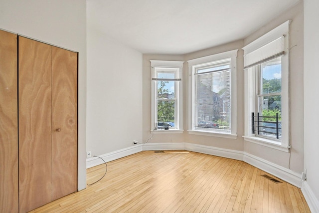 6225 S Wood St, Chicago, IL 60636 - unfurnished bedroom featuring hardwood / wood-style flooring and baseboards