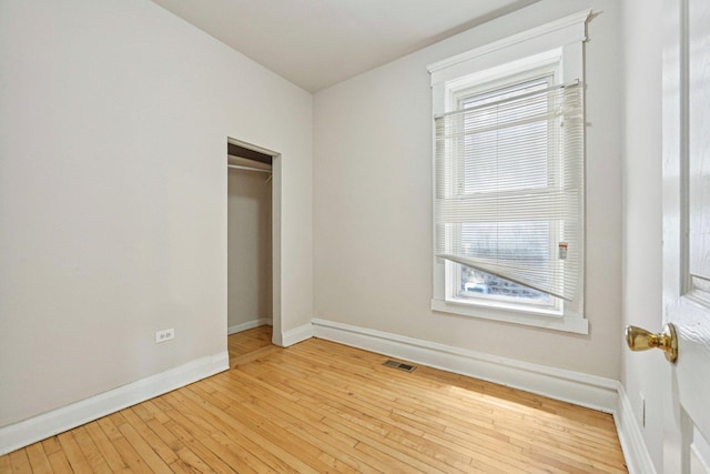 6225 S Wood St, Chicago, IL 60636 - unfurnished bedroom featuring hardwood / wood-style floors and a closet