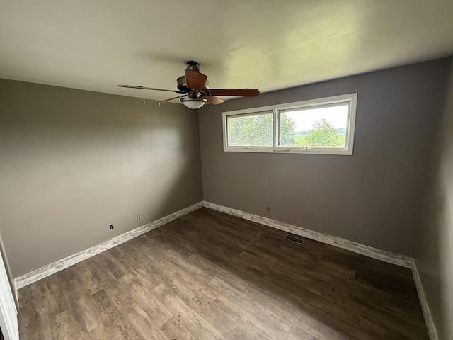 1826 Albert Ln, Wilmington, IL 60481 - spare room with a ceiling fan and dark wood-type flooring