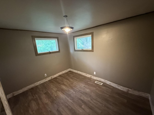 1826 Albert Ln, Wilmington, IL 60481 - empty room with dark wood-style flooring and baseboards