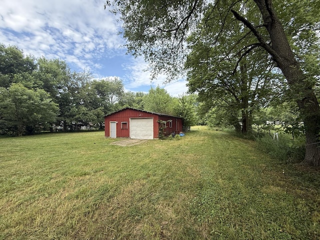 1826 Albert Ln, Wilmington, IL 60481 - view of green lawn featuring a garage, an outbuilding, and driveway