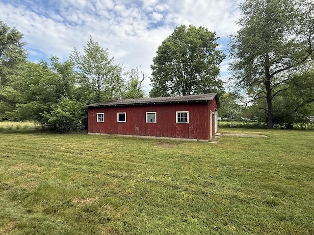 1826 Albert Ln, Wilmington, IL 60481 - view of property exterior with an outdoor structure and a lawn