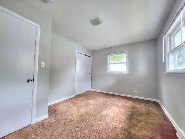 1808 13th St, Winthrop Harbor, IL 60096 - unfurnished bedroom featuring carpet, a closet, and a textured ceiling