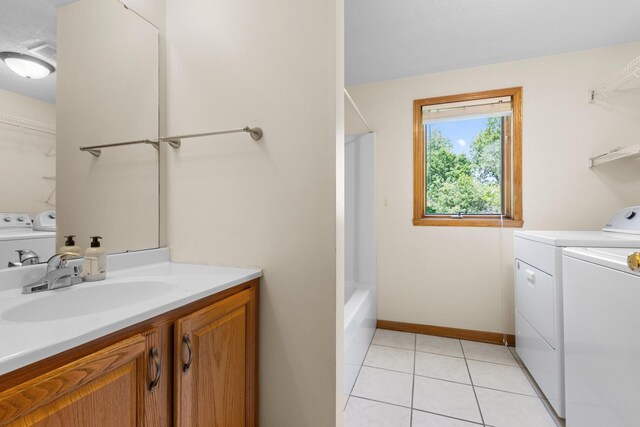 818 Metz Ln, Rockton, IL 61072 - laundry area with washing machine and clothes dryer and light tile patterned floors