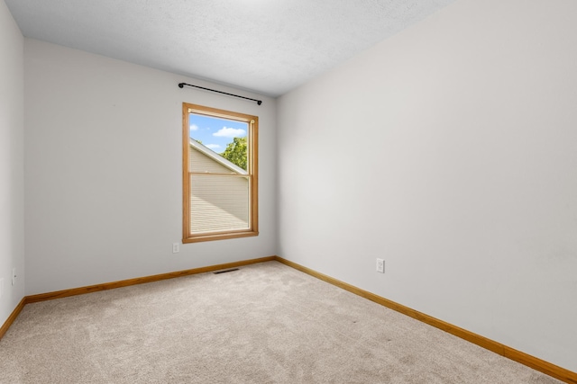 818 Metz Ln, Rockton, IL 61072 - carpeted spare room featuring baseboards and a textured ceiling