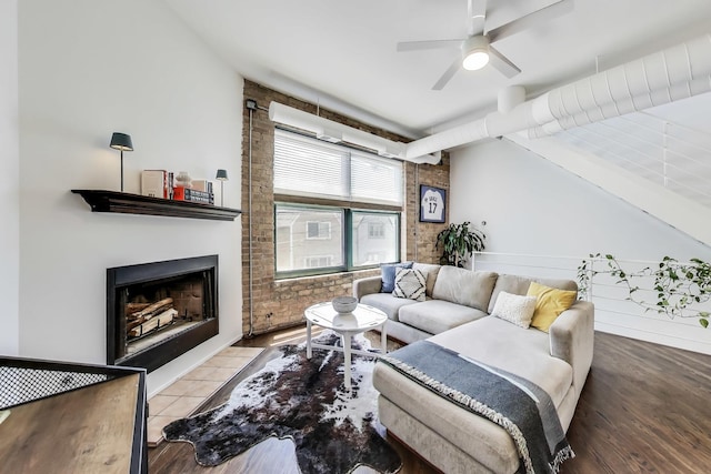 1720 N Marshfield Ave Unit 108, Chicago, IL 60622 - living room with ceiling fan, a fireplace, and brick wall