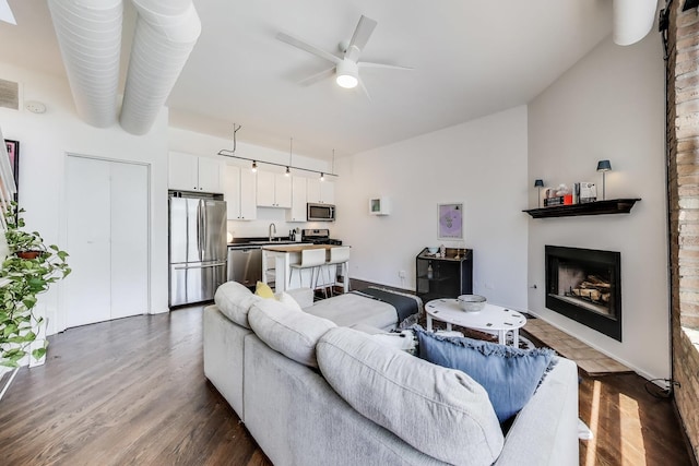 1720 N Marshfield Ave Unit 108, Chicago, IL 60622 - living room with dark wood-style flooring, a fireplace, and a ceiling fan