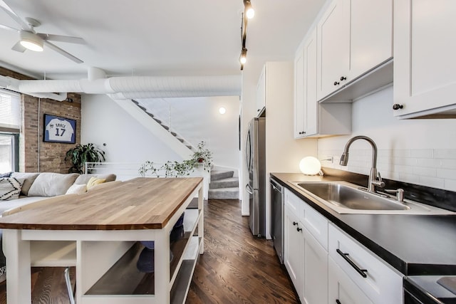1720 N Marshfield Ave Unit 108, Chicago, IL 60622 - kitchen featuring butcher block counters, stainless steel appliances, dark wood-type flooring, tasteful backsplash, and a ceiling fan