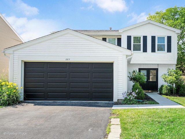 865 W Bryn Mawr Ave, Roselle, IL 60172 - view of front of property featuring driveway and a garage