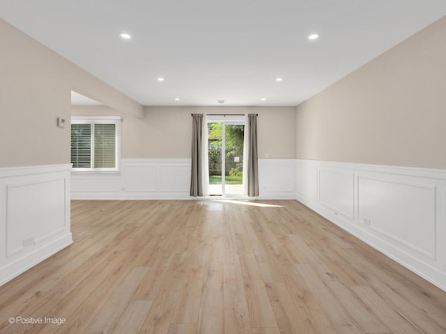 865 W Bryn Mawr Ave, Roselle, IL 60172 - empty room featuring wainscoting, light wood finished floors, a decorative wall, and recessed lighting