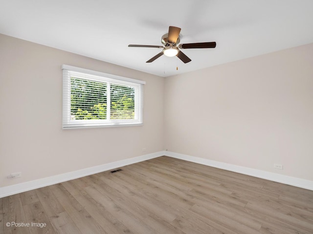 865 W Bryn Mawr Ave, Roselle, IL 60172 - empty room featuring wood finished floors and a ceiling fan