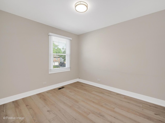 865 W Bryn Mawr Ave, Roselle, IL 60172 - unfurnished room with light wood-type flooring and baseboards
