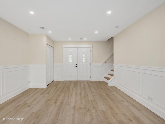 865 W Bryn Mawr Ave, Roselle, IL 60172 - entryway with light wood-style flooring, a wainscoted wall, a decorative wall, recessed lighting, and stairway