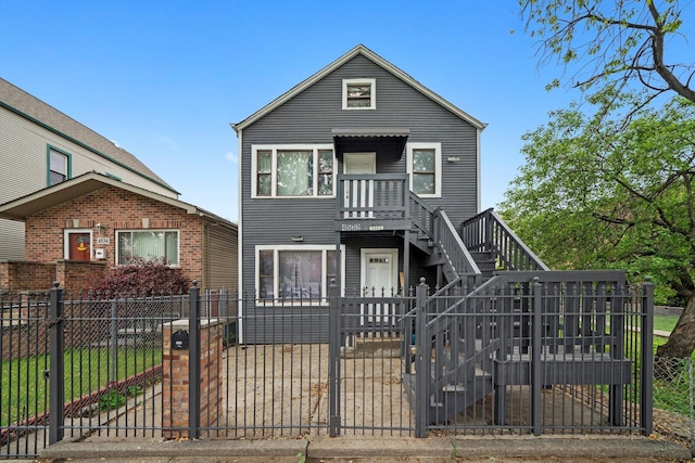 4532 S Laflin St, Chicago, IL 60609 - view of front facade with a fenced front yard, stairs, and a gate