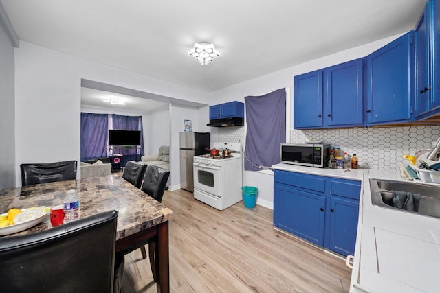 4532 S Laflin St, Chicago, IL 60609 - kitchen featuring white gas stove, blue cabinets, and under cabinet range hood