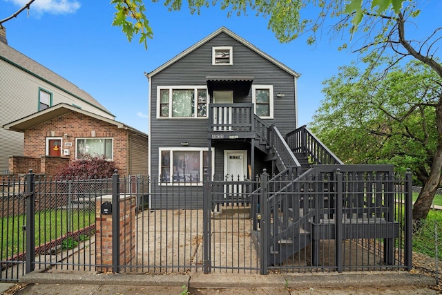 4532 S Laflin St, Chicago, IL 60609 - view of front of home featuring a fenced front yard, stairway, and a gate