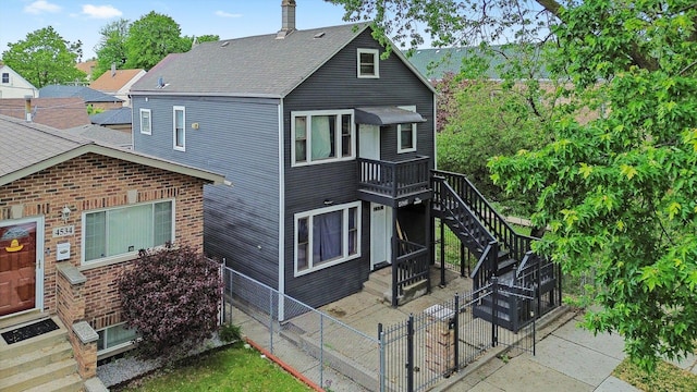 4532 S Laflin St, Chicago, IL 60609 - view of front facade featuring stairway and a patio area