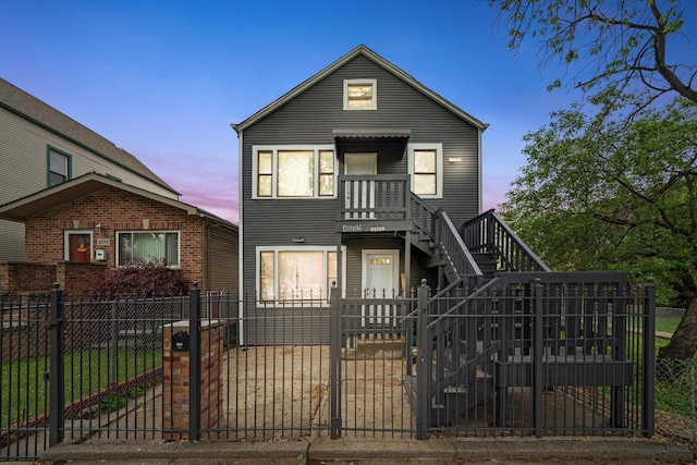 4532 S Laflin St, Chicago, IL 60609 - view of front facade with stairway, a fenced front yard, and a gate