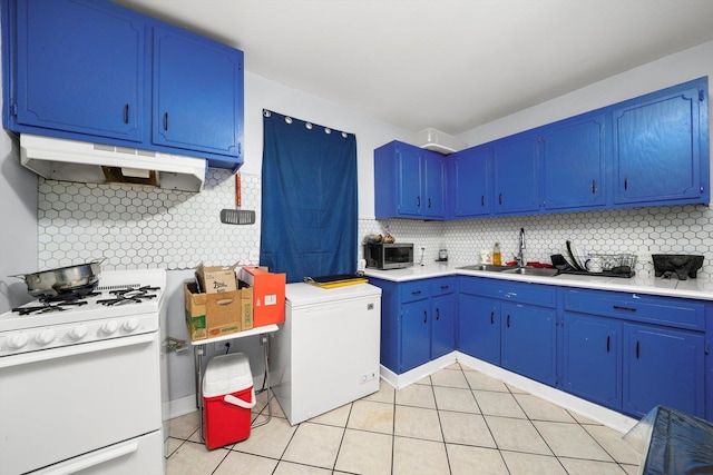 4532 S Laflin St, Chicago, IL 60609 - kitchen featuring white range, under cabinet range hood, fridge, light countertops, and backsplash