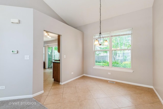 1109 Blackburn Dr, Grayslake, IL 60030 - unfurnished room with light tile patterned flooring, vaulted ceiling, and a chandelier