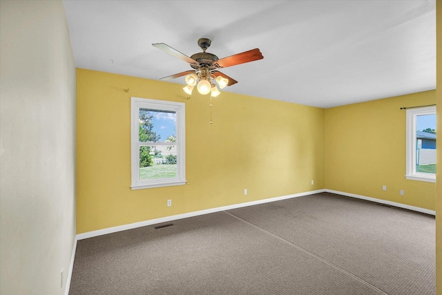 203 E Wilson, Tuscola, IL 61953 - empty room with healthy amount of natural light, carpet floors, and ceiling fan
