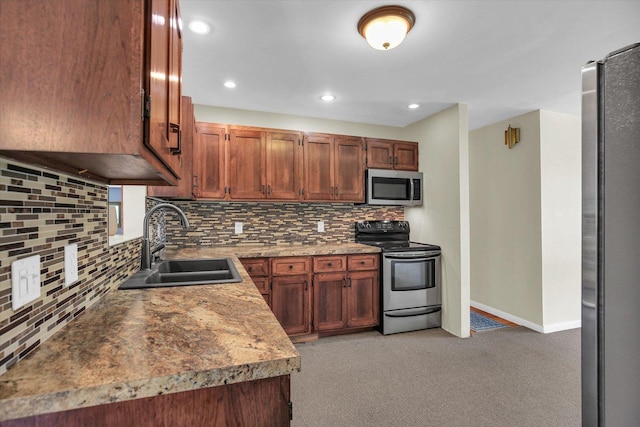 203 E Wilson, Tuscola, IL 61953 - kitchen with appliances with stainless steel finishes, decorative backsplash, light carpet, recessed lighting, and light countertops