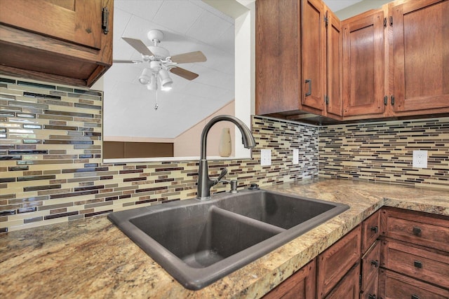 203 E Wilson, Tuscola, IL 61953 - kitchen featuring tasteful backsplash, a ceiling fan, and brown cabinets