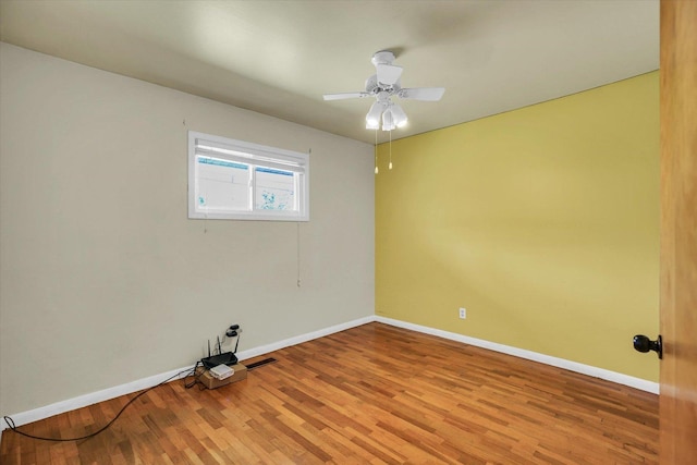 203 E Wilson, Tuscola, IL 61953 - empty room with wood finished floors and a ceiling fan