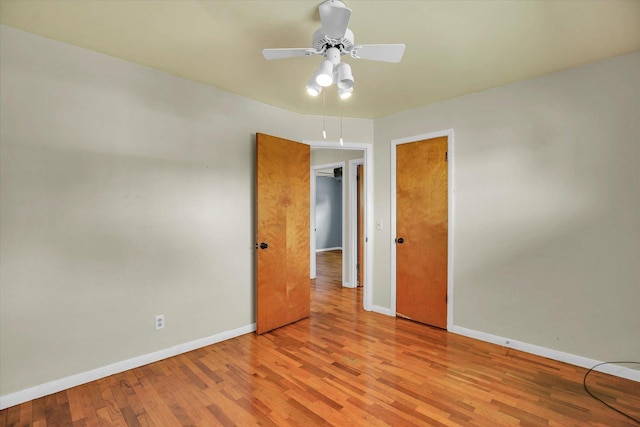 203 E Wilson, Tuscola, IL 61953 - empty room with light wood finished floors and a ceiling fan