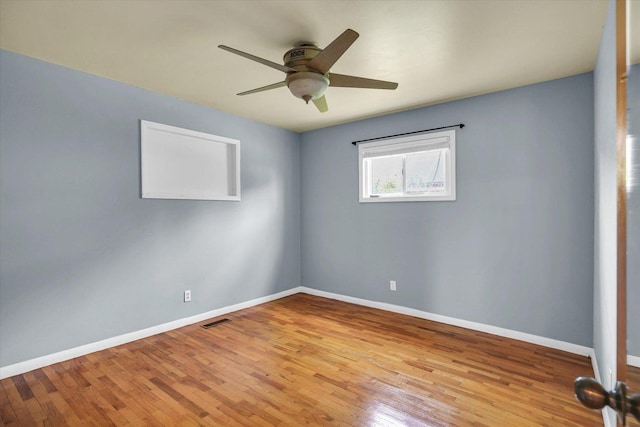 203 E Wilson, Tuscola, IL 61953 - empty room featuring wood finished floors and ceiling fan