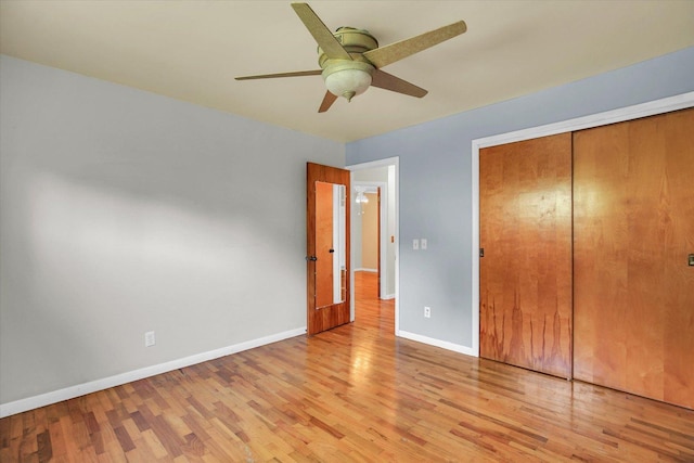 203 E Wilson, Tuscola, IL 61953 - unfurnished bedroom with light wood-style floors, a closet, and ceiling fan